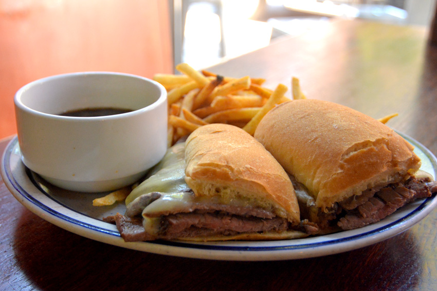French dip sandwich with au jus and fries