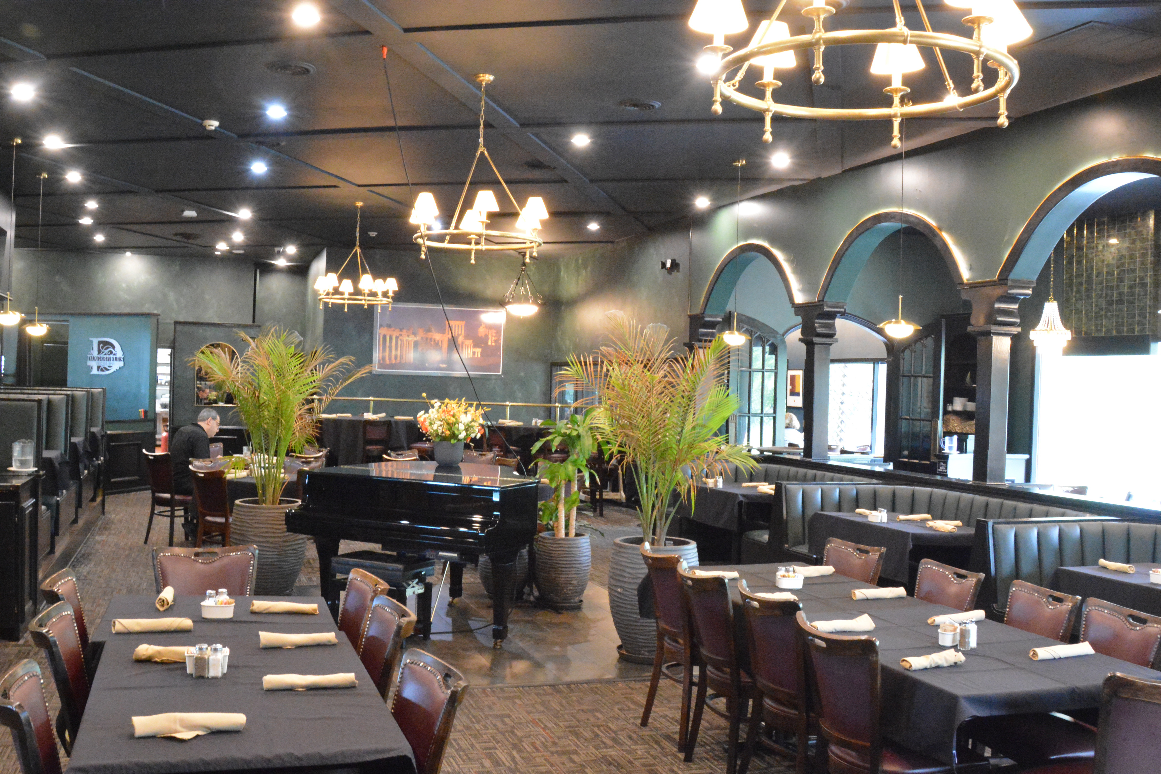 Restaurant interior photography — wide-angle dining floor with booth seating